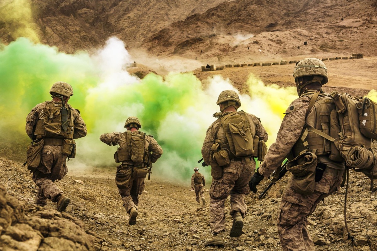 U.S. Marines assigned to Fox Company, Battalion Landing Team, 2nd Battalion, 6th Marine Regiment, 26th Marine Expeditionary Unit, run to firing positions during live-fire training in Jordan as part of Eager Lion 2018, April 21, 2018. Eager Lion was a capstone training engagement that provided U.S. forces and the Jordan Armed Forces an opportunity to rehearse operating in a coalition environment and to pursue new ways to collectively address threats to regional security and improve overall maritime security. (U.S. Marine Corps photo by Staff Sgt. Dengrier M. Baez/Released)