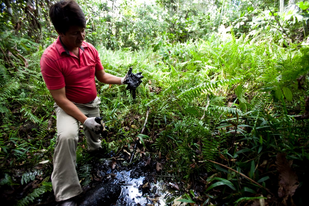 Crude contaminates an open toxic pool in the the Ecuadorian Amazon rainforest near Lago Agrio. It was abandoned by Texaco (now Chevron) after oil drilling operations ended in 1990 and was never remediated.