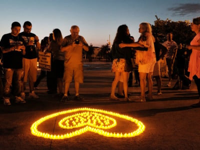 People attend a candlelight vigil for victims of opioid use on August 24, 2017 in the borough of Staten Island in New York City.