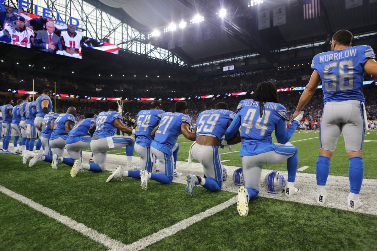 Members of the Detroit Lions take a knee during the playing of the national anthem prior to the start of the game against the Atlanta Falcons at Ford Field on September 24, 2017, in Detroit, Michigan.