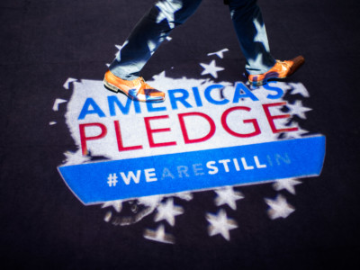 Visitors enter the US 'We Are Still In' pavilion at the COP 23 United Nations Climate Change Conference on November 11, 2017 in Bonn, Germany. A delegation of US business, state and city government presented a report detailing the efforts of US states, cities and businesses to keep America on line in fulfilling goals towards carbon reduction set out by the Paris Climate Agreement.