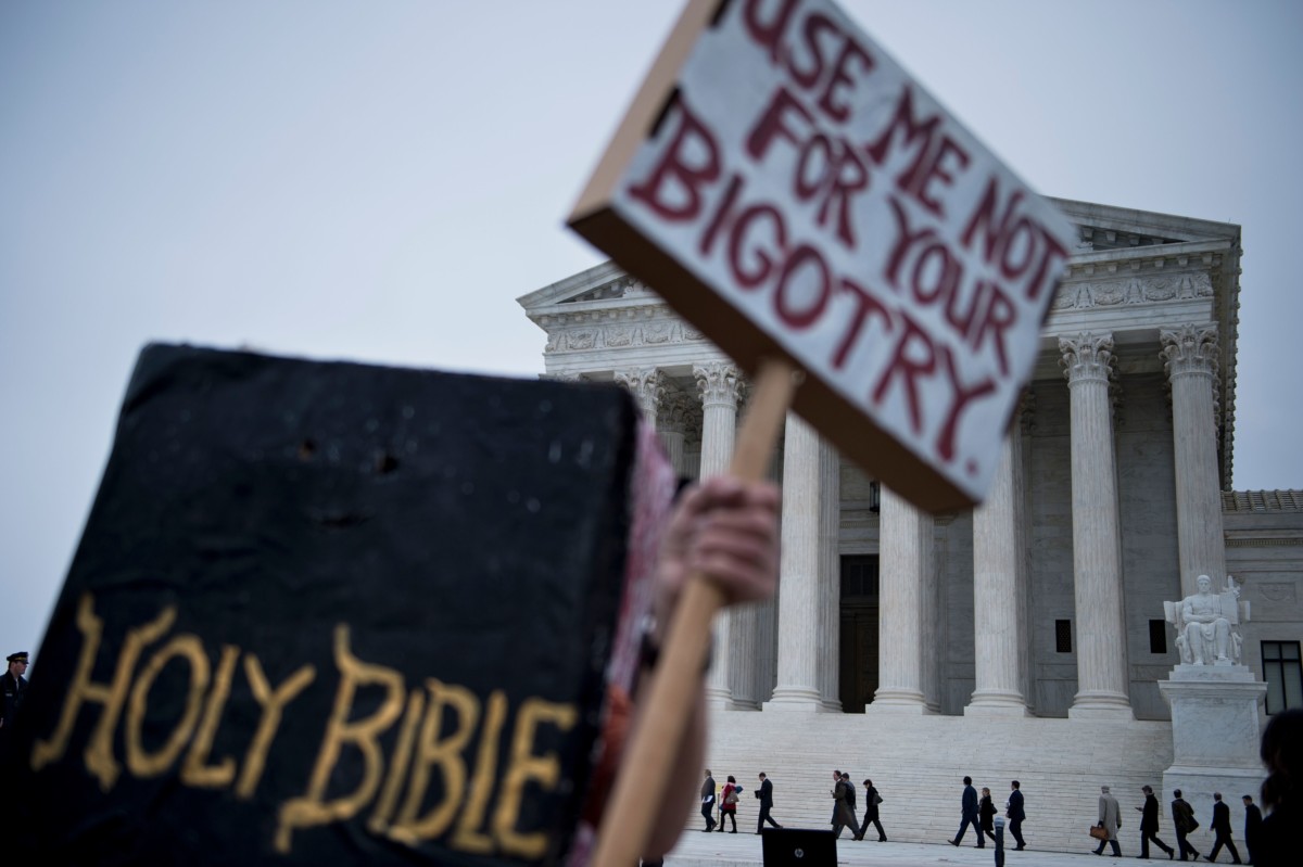 People arrive outside the US Supreme Court before Masterpiece Cakeshop vs. Colorado Civil Rights Commission is heard on December 5, 2017, in Washington, DC.