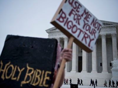 People arrive outside the US Supreme Court before Masterpiece Cakeshop vs. Colorado Civil Rights Commission is heard on December 5, 2017, in Washington, DC.