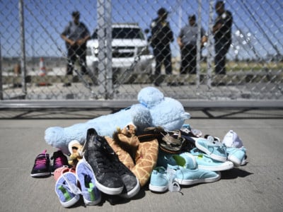 Shoes are left by people at the Tornillo Port of Entry near El Paso, Texas, June 21, 2018 during a protest rally by several American mayors against the US administration's family separation policy.