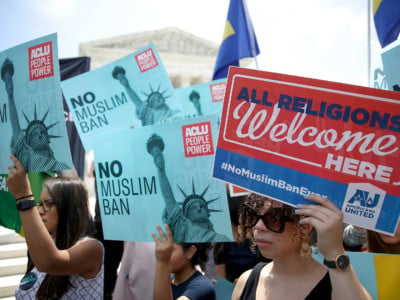 Protesters gather outside the US Supreme Court as the court issued an immigration ruling June 26, 2018, in Washington, DC. The court issued a 5-4 ruling upholding the Trump administration's policy imposing limits on travel from several primarily Muslim nations.