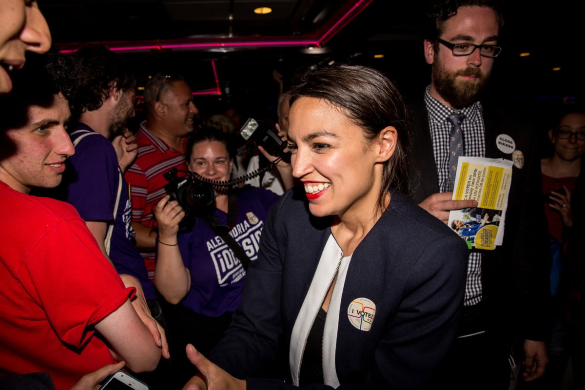 Progressive challenger Alexandria Ocasio-Cortez celebrates with supporters at a victory party in the Bronx after upsetting incumbent Democratic Representative Joseph Crowly on June 26, 2018, in New York City.