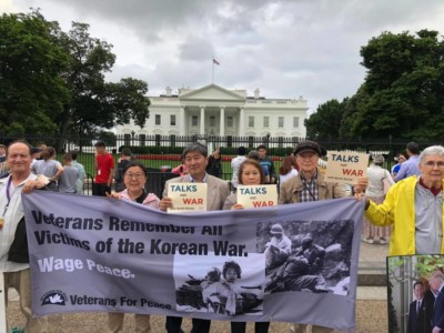 Korean American activists hold a vigil for peace on June 12, 2018, outside the White House in Washington, DC.