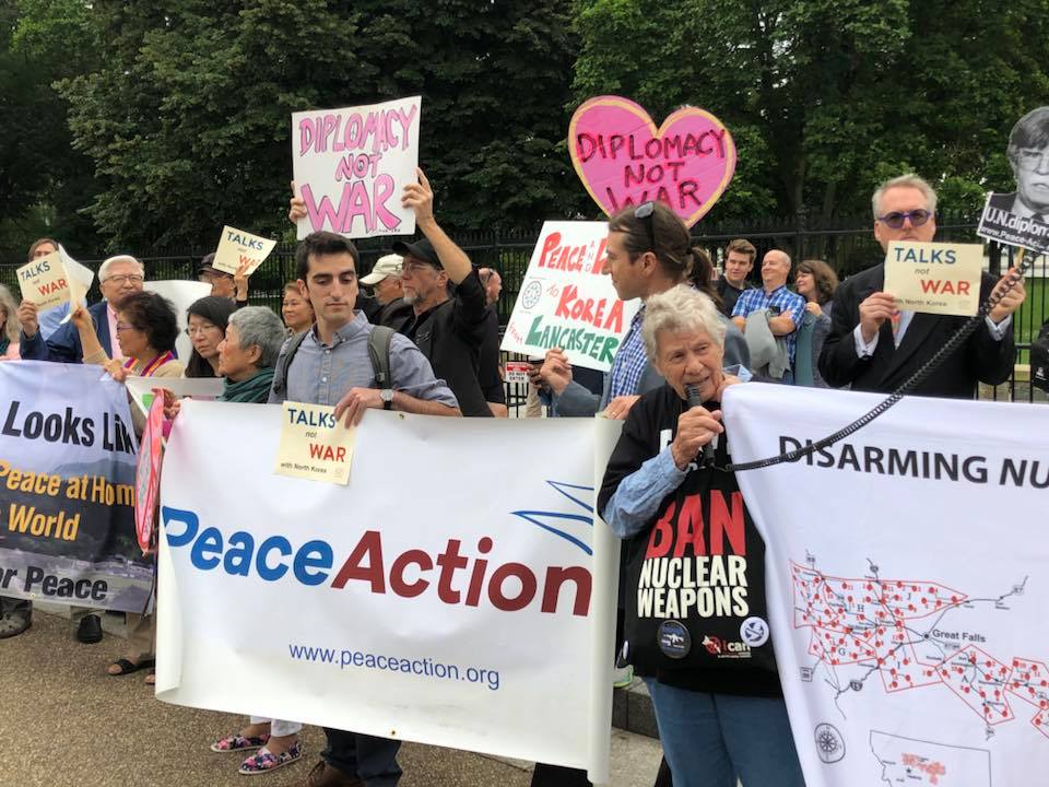 Demonstrators call for diplomacy rather than the escalation of tensions between the US and North Korea during a vigil for peace on June 12, 2018, outside the White House in Washington, DC.