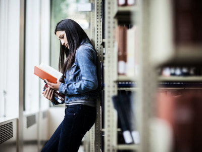 Hispanic student in library