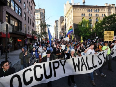 Occupy Wall Street protesters march down Broadway toward lower Manhattan in May, 2012. The Occupy movement represented "open spaces of resistance" and power emanating from group organizing.