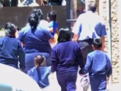 Dozens of immigrant children were detained in a vacant Phoenix office building at the height of President Trump’s family separation policy. Neighbors videotaped workers leading children into the building, which is not licensed as a child care center.