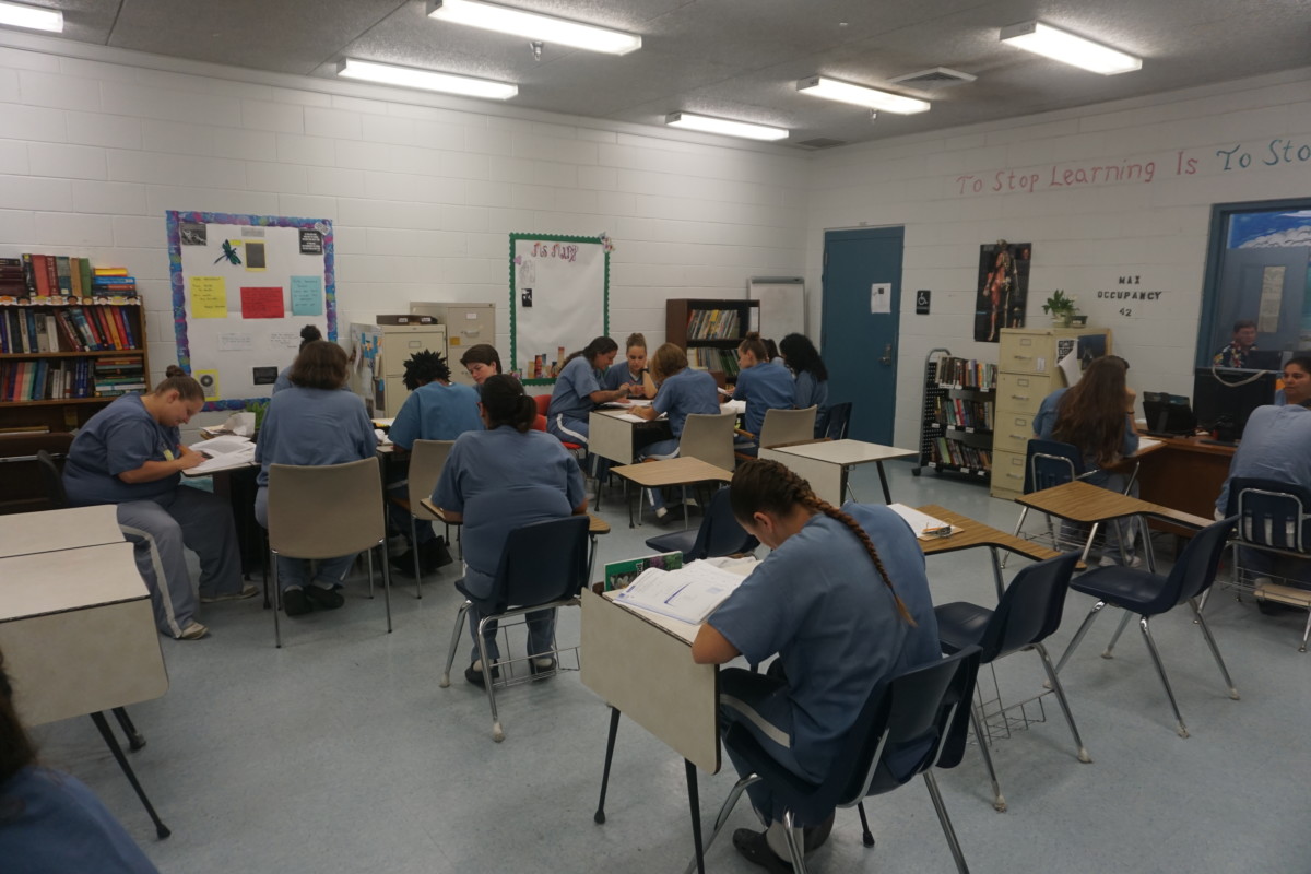 Prisoners at Lowell Correctional Facility in Ocala, Florida, engage in a volunteer-led literacy program.