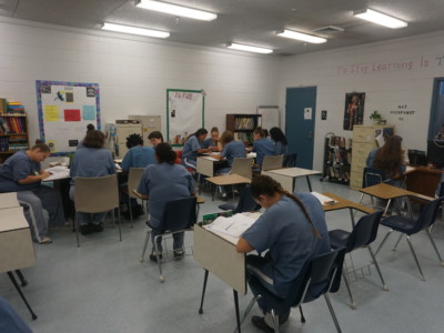 Prisoners at Lowell Correctional Facility in Ocala, Florida, engage in a volunteer-led literacy program.