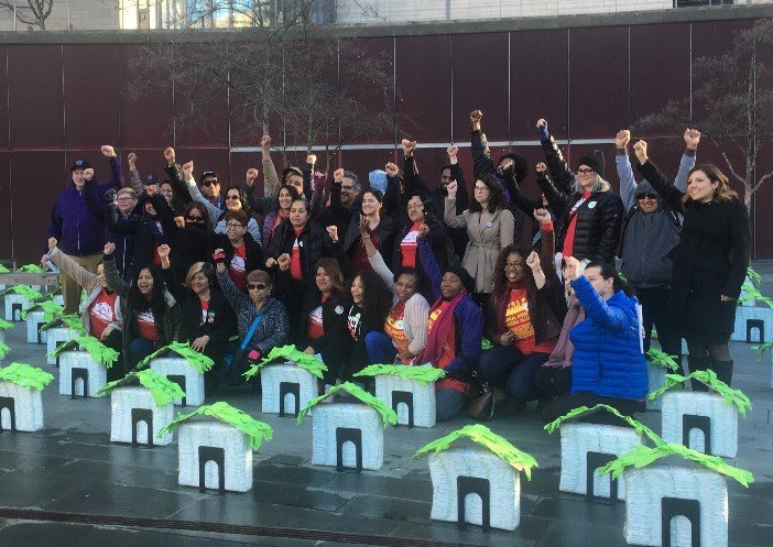 Domestic workers rally on March 2018 after sharing their stories with the Seattle City Council members to make the case for the city's first Domestic Worker Bill of Rights.