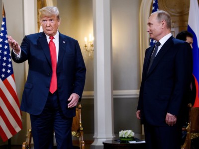 President Donald Trump and Russia's President Vladimir Putin wait ahead of a meeting in Helsinki, on July 16, 2018.