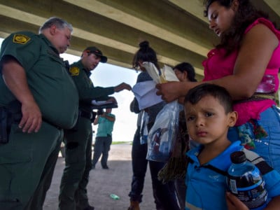 A 3-year-old boy from Guatemala and his family are detained by US Border Patrol agents for illegally crossing into the US from Mexico on Wednesday, June 27, 2018, in Mission, Texas.