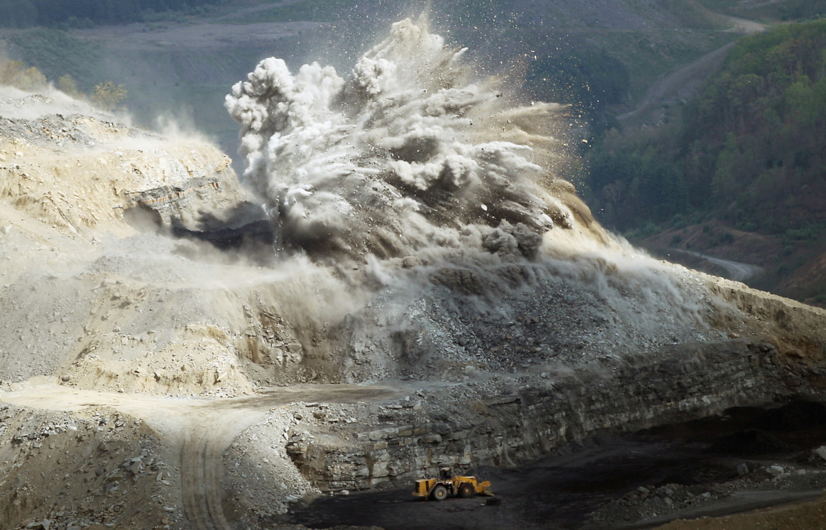 An explosive is detonated at an A & G Coal Corporation surface mining operation in the Appalachian Mountains on April 16, 2012, in Wise County, Virginia. Critics refer to this type of mining as "mountaintop-removal mining" which has destroyed 500 mountain peaks and at least 1,200 miles of streams while causing increased flooding.