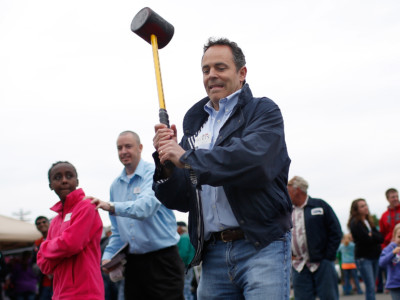 Gov. Matt Bevin swings a mallet on the 'High Striker' game at the Fountain Run BBQ Festival while campaigning for the Republican primary May 17, 2014, in Fountain Run, Kentucky.