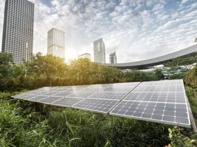 Solar panels surrounded by buildings