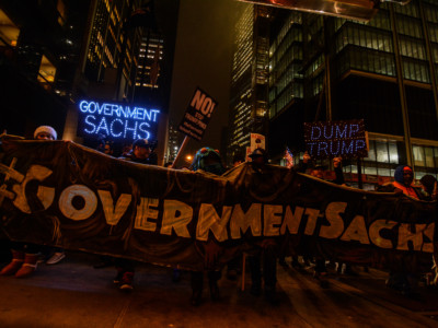 Protesters demonstrate after comments from Donald Trump on rolling back Dodd-Frank and his finanical executive order written by former Goldman employee Gary Cohn at Liberty St. near Federal Reserve Bank of New York, February 7, 2017.