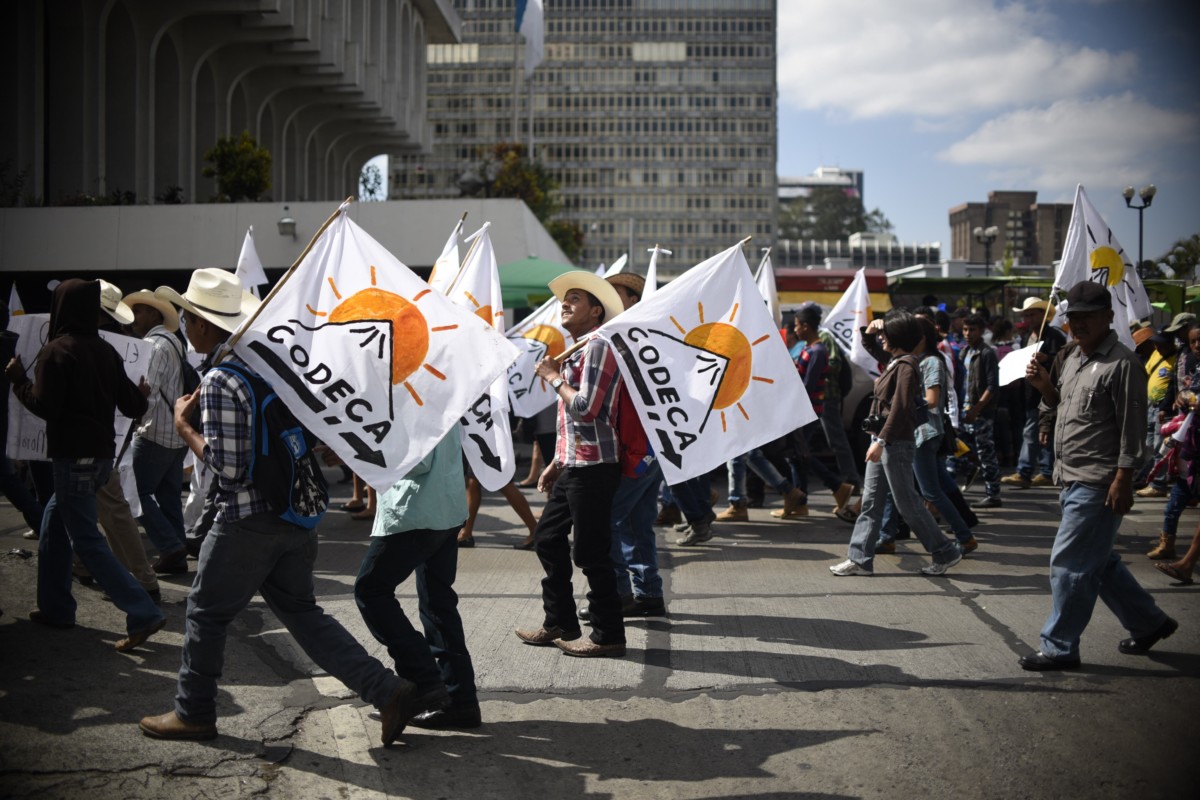 Members of the Guatemalan Campesino Development Committee (CODECA) march to demand the resignation of Guatemalan President Jimmy Morales for 'his inability to govern' and possible acts of corruption in his government, in Guatemala City on March 7, 2017.