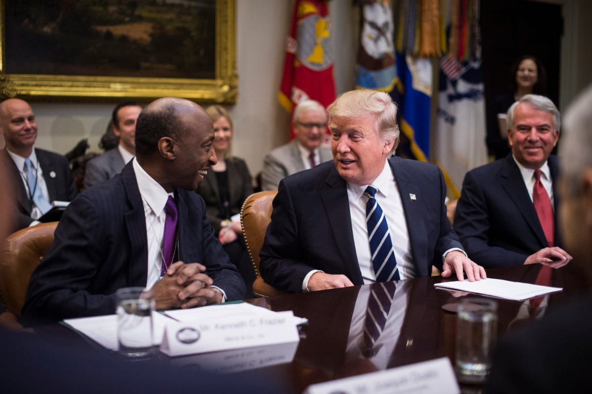 Merck Chairman and CEO Ken Frazier, left, talks to President Trump during a meeting with pharmaceutical industry leaders in the Roosevelt Room of the White House in Washington, DC, on Tuesday, January 31, 2017.