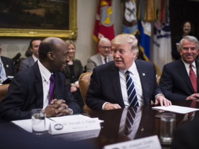 Merck Chairman and CEO Ken Frazier, left, talks to President Trump during a meeting with pharmaceutical industry leaders in the Roosevelt Room of the White House in Washington, DC, on Tuesday, January 31, 2017.