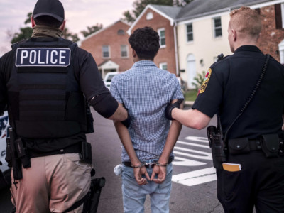 Northern Virginia Gang Task Force officers partner with ICE officer to arrest a Latino man in a Manassas, Virginia, neighborhood on August 10, 2017.