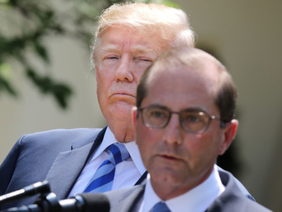 President Donald Trump listens to Health and Human Services Secretary Alex Azar deliver remarks during an announcement about drug prices in the Rose Garden at the White House May 11, 2018, in Washington, DC.