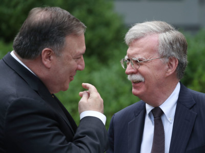 Secretary of State Mike Pompeo talks with White House National Security Advisor John Bolton before a news conference in the Rose Garden at the White House, on June 7, 2018, in Washington, DC.