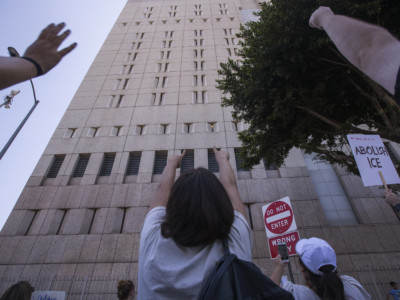 People call out words of encouragement to detainees held inside the Metropolitan Detention Center after marching to decry Trump administration immigration and refugee policies on June 30, 2018, in Los Angeles, California.