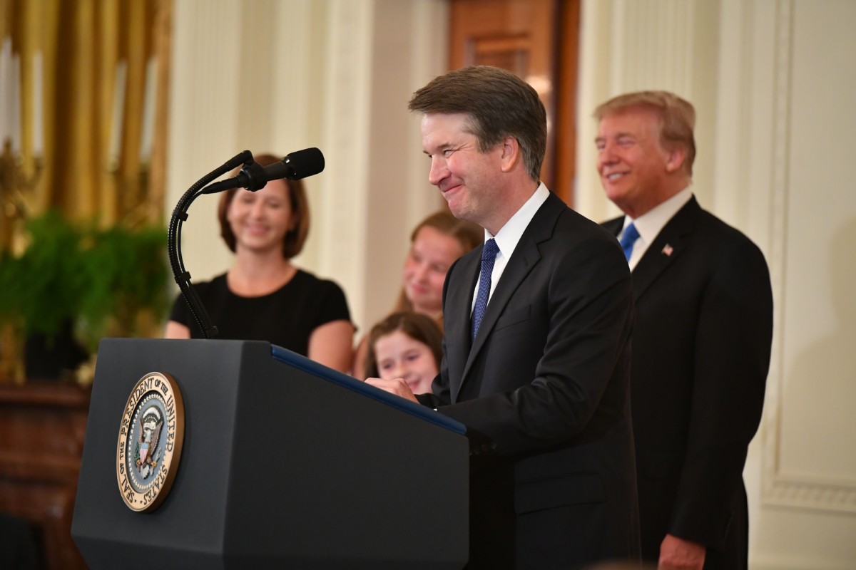 Supreme Court nominee Brett Kavanaugh speaks while his wife Ashley Estes Kavanaugh and President Donald Trump listen after the announcement of his nomination in the East Room of the White House on July 9, 2018, in Washington, DC.