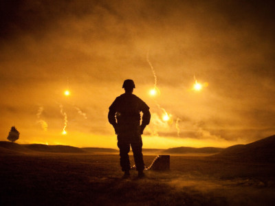 A soldier observes the pyrotechnics finale for an Army competition conducted at Fort Lee, Virginia, October 5, 2011.