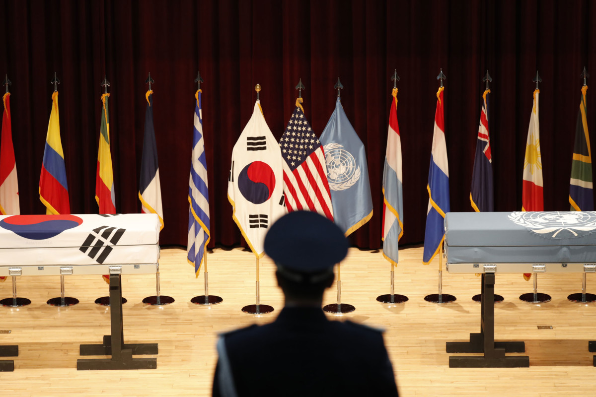 A South Korean honor guard stands in front of boxes containing the remains of United Nations Command (UNC) and South Korean soldiers who were killed in North Korea in the 1950-53 Korean War during the mutual repatriation ceremony of soldiers' remains between South Korea and US at the Seoul National Cemetery on July 13, 2018, in Seoul, South Korea.