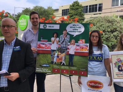 Community members and environmental activists demonstrate outside Whole Foods's headquarters in Austin, Texas, on August 2, 2018.