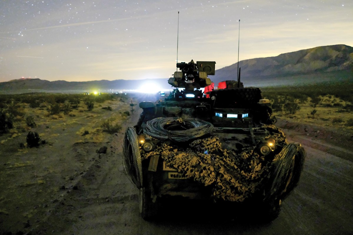 A US military Stryker crew pulls security during a "decisive action" rotation at the National Training Center in Fort Irwin, California, on January 13, 2018.