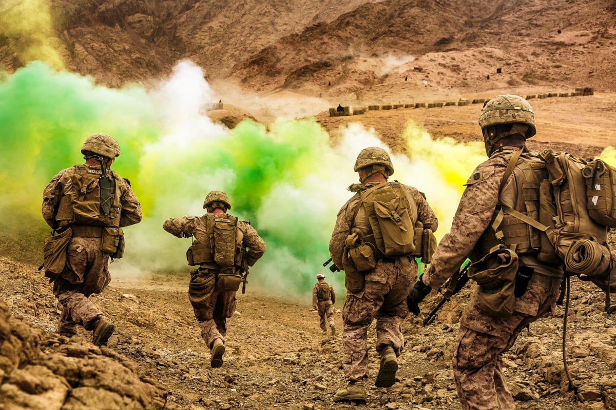 US Marines run to firing positions during live-fire training in Jordan, April 21, 2018.