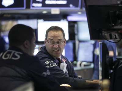 Traders and financial professionals work ahead of the closing bell on the floor of the New York Stock Exchange, July 19, 2018, in New York City. Stocks were slightly down on Thursday, the same day Donald Trump criticized the Federal Reserve and expressed his disappointment concerning interest rate hikes.