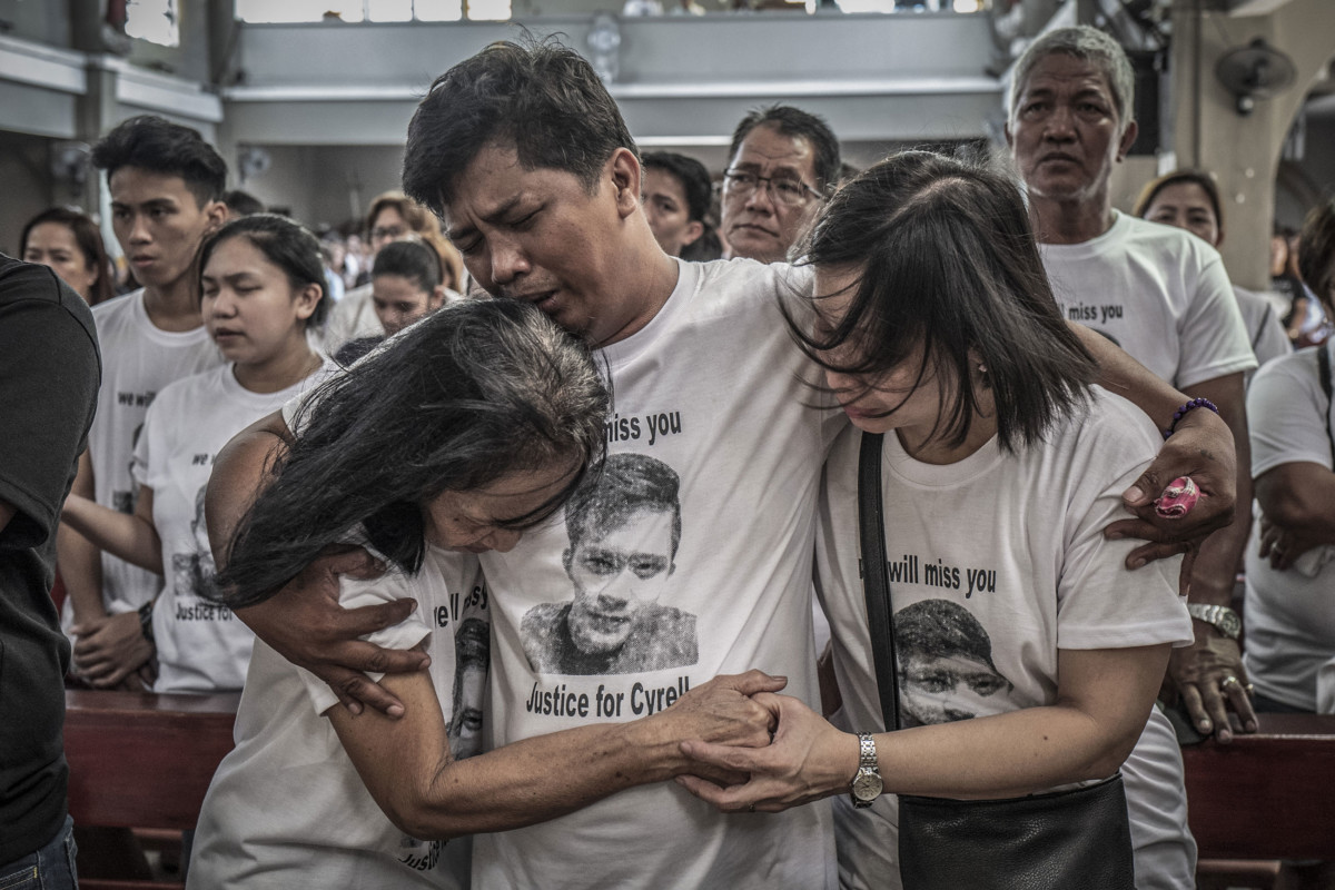 Mourners take part in the funeral of Jhan Cyrell Ignacio, a college freshman who was killed by unidentified gunmen, in Malabon, Metro Manila, in the Philippines on July 14, 2018. More than 27,000 have been killed as a result of a two-year war on drugs in the Philippines.