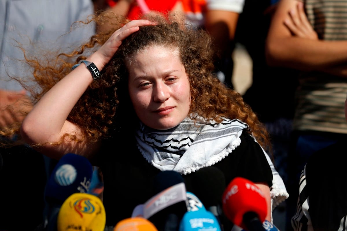 Palestinian activist and campaigner Ahed Tamimi speaks during a press conference in the West Bank village of Nabi Saleh on July 29, 2018, upon her release from prison after an eight-month sentence.