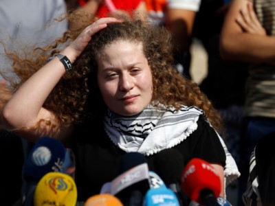 Palestinian activist and campaigner Ahed Tamimi speaks during a press conference in the West Bank village of Nabi Saleh on July 29, 2018, upon her release from prison after an eight-month sentence.