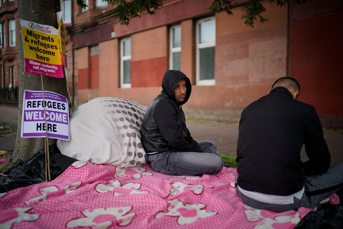Afghan refugee Rahman Sahah, 32, and Mirwais Ahmadzai, 27, start their hunger strike outside Her Majesty's Government home office on August 1, 2018, in Glasgow, Scotland.