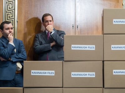 Aides attend a news conference with Republican members of the Senate Judiciary Committee in the Dirksen Building on August 2, 2018, with boxes representing roughly 1 million pages of documents to be submitted to the committee on Supreme Court nominee Brett Kavanaugh.