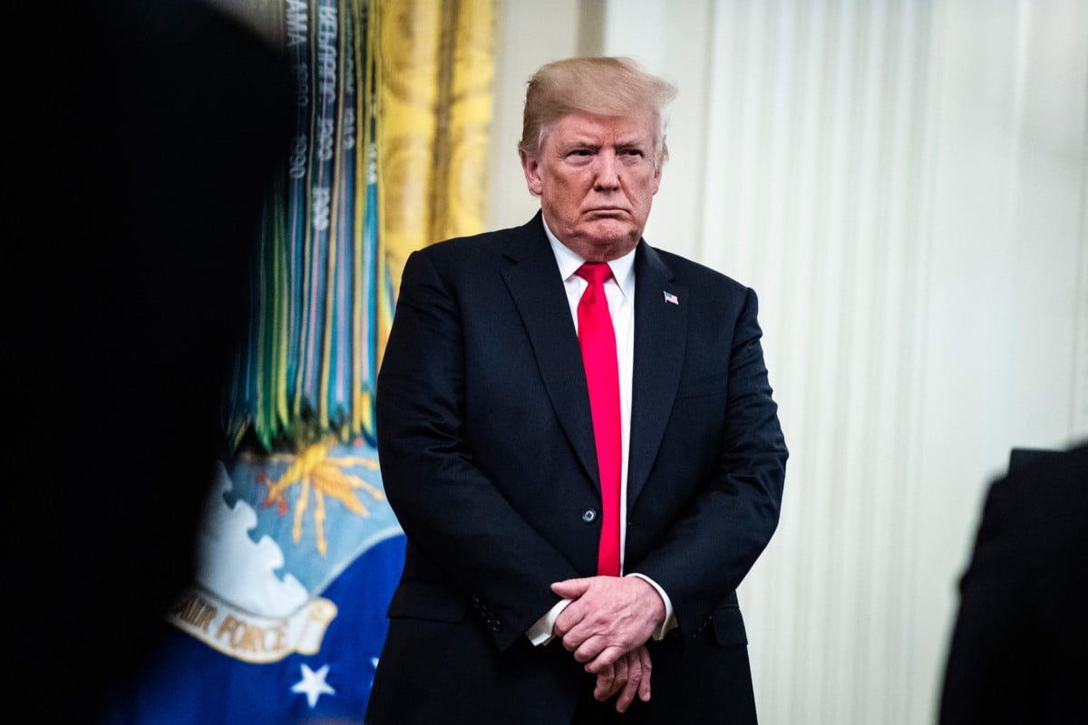 President Trump listens to a prayer after presenting Valerie Nessel, widow of Air Force Technical Sergeant John Chapman, with the posthumous Medal of Honor for her husband during a ceremony in East Room of the White House on Wednesday, Auguat 22, 2018, in Washington, DC.