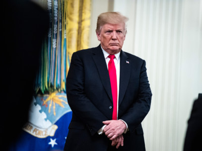 President Trump listens to a prayer after presenting Valerie Nessel, widow of Air Force Technical Sergeant John Chapman, with the posthumous Medal of Honor for her husband during a ceremony in East Room of the White House on Wednesday, Auguat 22, 2018, in Washington, DC.