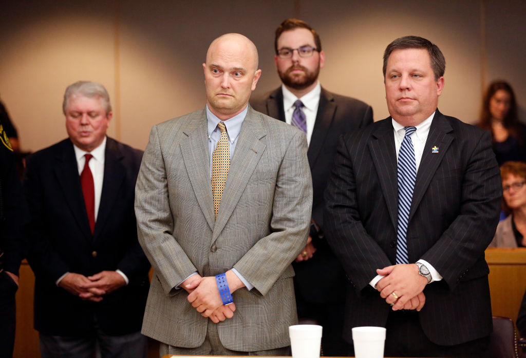 Roy Oliver, fired Balch Springs police officer, standing next to his defense attorney Miles Brissette (far right), reacts after receiving a sentence of 15 years in prison for the murder of 15-year-old Jordan Edwards after over five hours of punishment deliberation at the Frank Crowley Courts Building in Dallas on Wednesday, Aug. 29, 2018.