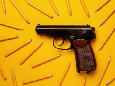 A handgun with pencils