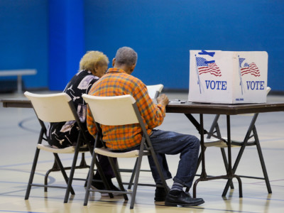 An elderly couple reads a ballot prior to voting on November 8, 2016, in Durham, North Carolina.