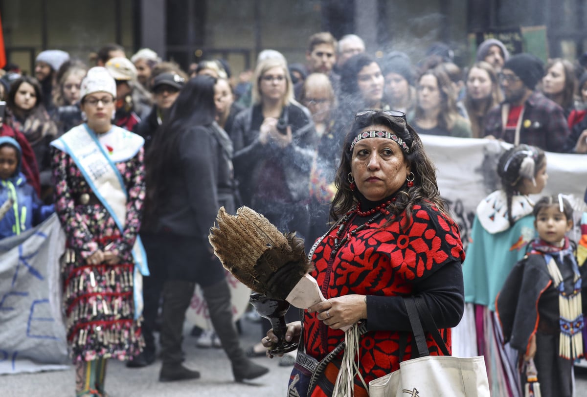 Native American protesters are joined by anti-Trump and other demonstrators as they march against the Dakota Access Pipeline in Chicago, Illinois, on November 12, 2016.