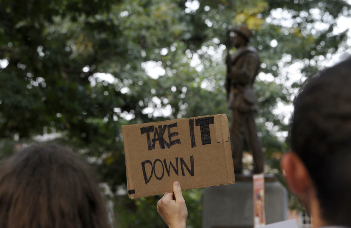 Demonstrators rally for the removal of a Confederate statue coined Silent Sam on the campus of the University of Chapel Hill on August 22, 2017, in Chapel Hill, North Carolina. Students and other protesters tore the statue down on August 20, 2018.